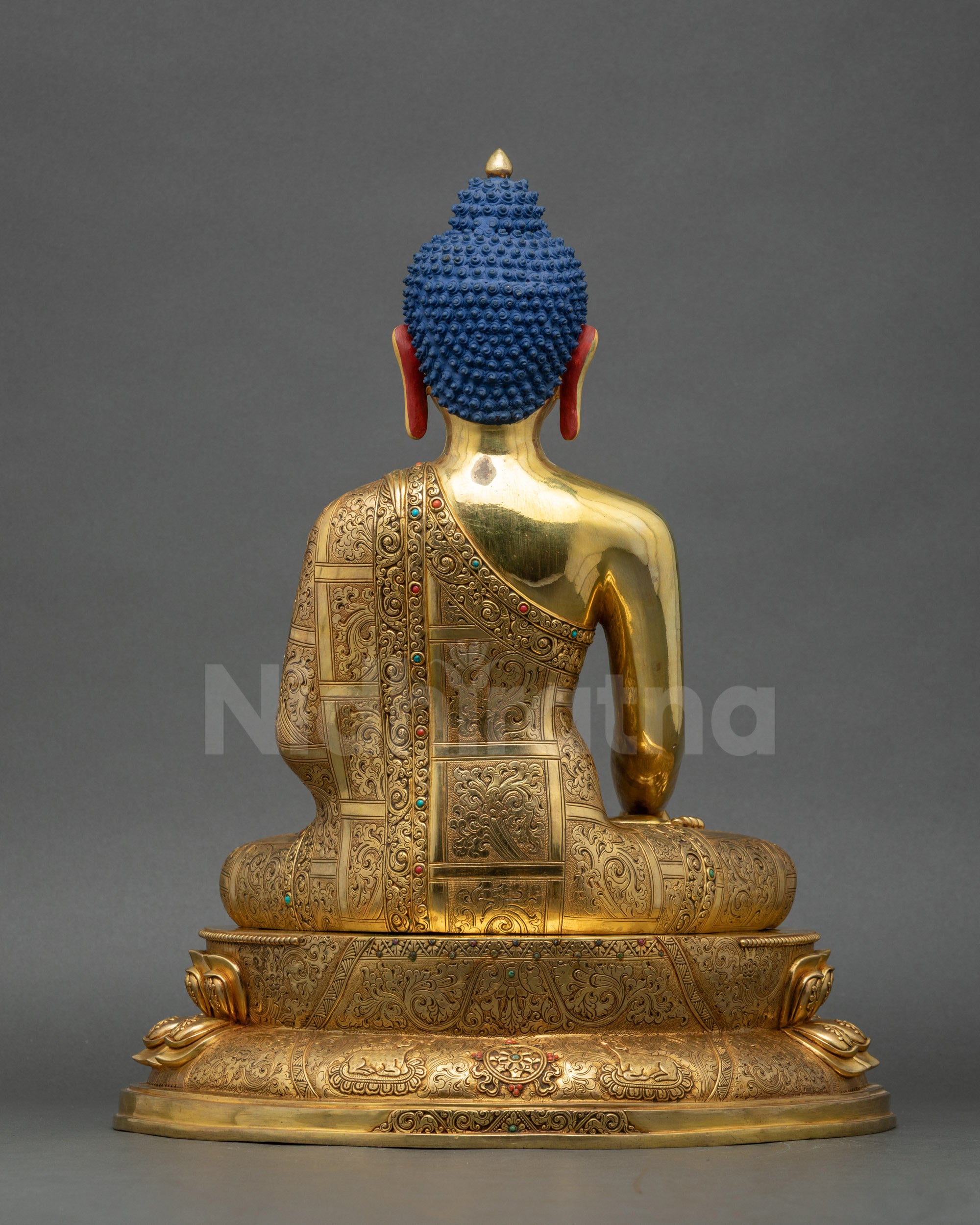 Back view of Enlightened Shakyamuni Buddha Statue highlighting detailed carved robes and patterns