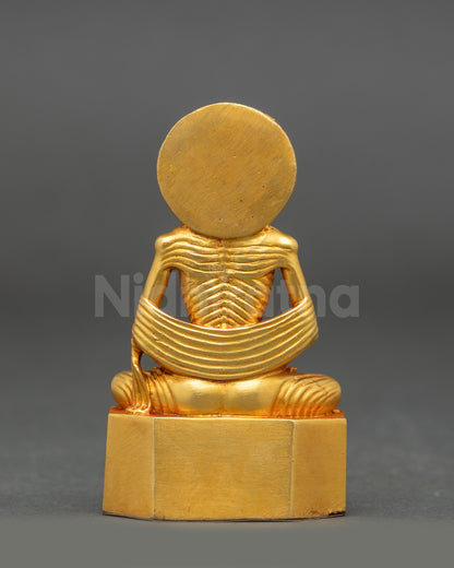Back view of Fasting shakyamuni 
Buddha seated on lotus with intricate gold fire-gilded detailing