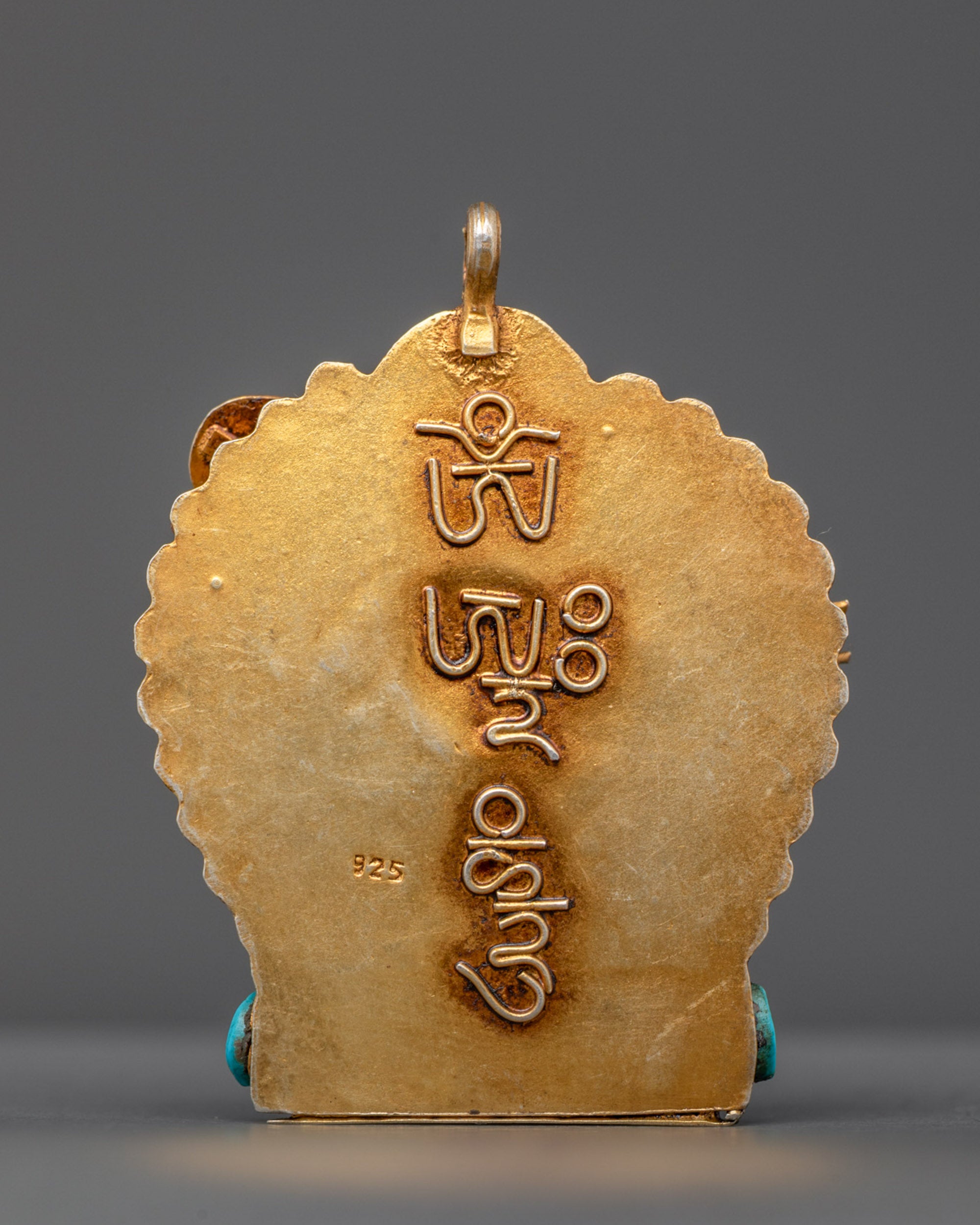 Back view of Ganesh amulet with detailed artisan filigree from traditional Nepalese craftsmanship