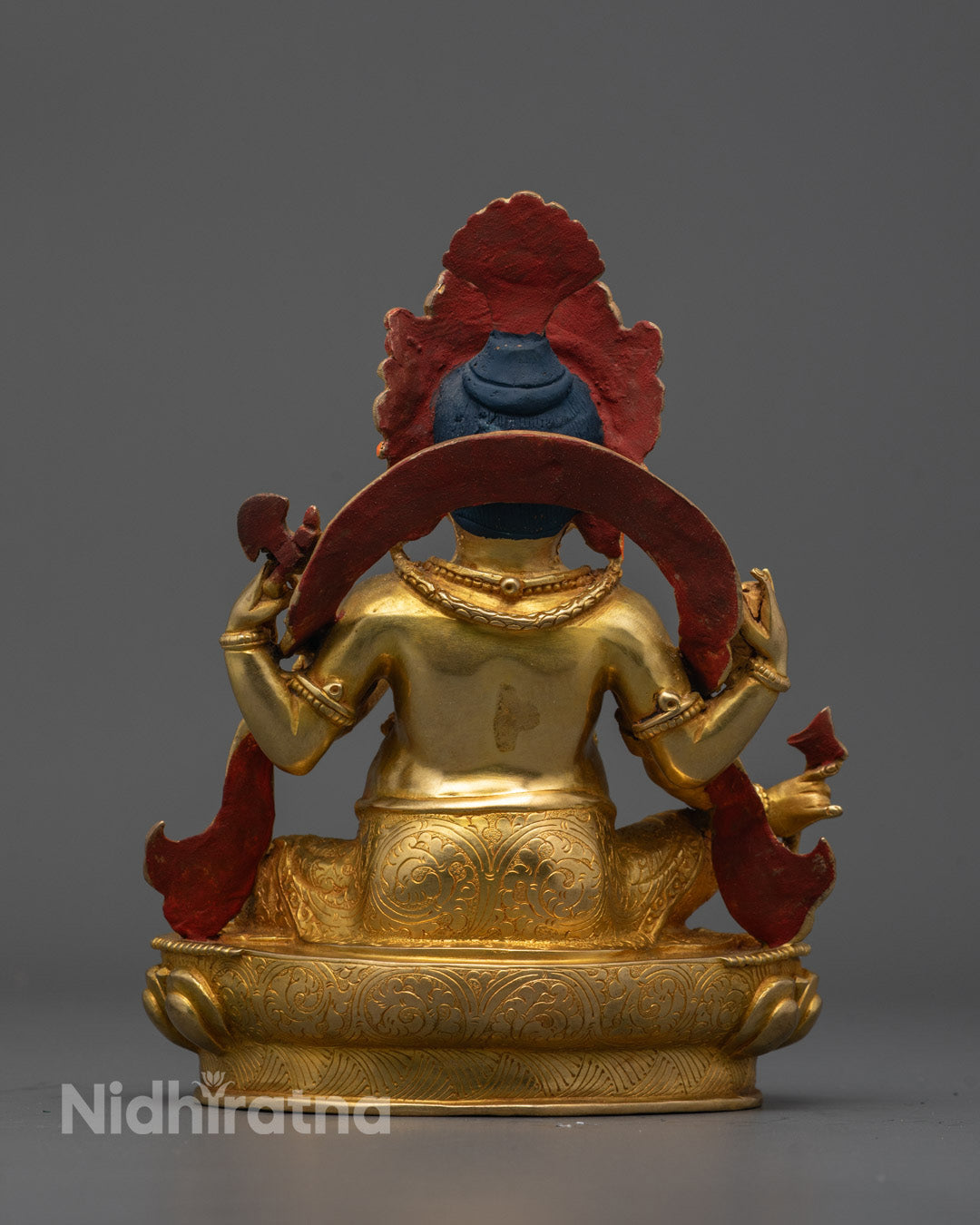Back view of Ganesha sculpture displaying lost wax craftsmanship and symbolic patterns
