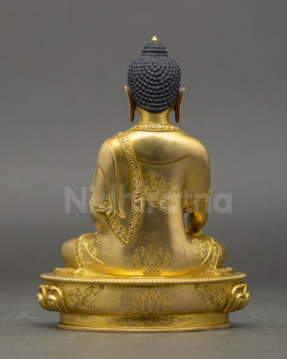 Back view of Gautama Buddha Statue showing lotus seat and robe details