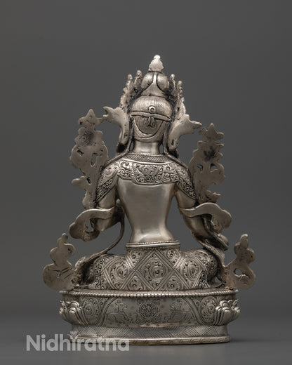 Back view of Green Tara Sculpture holding lotus flower, handcrafted Buddhist art from Nepal