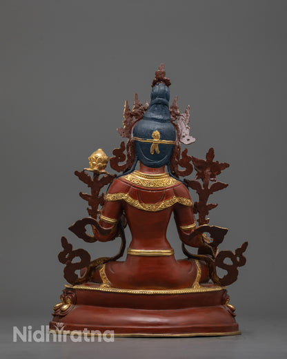 Back view of Green Tara Sculpture sitting gracefully on lotus seat, crafted by Nepalese artisan