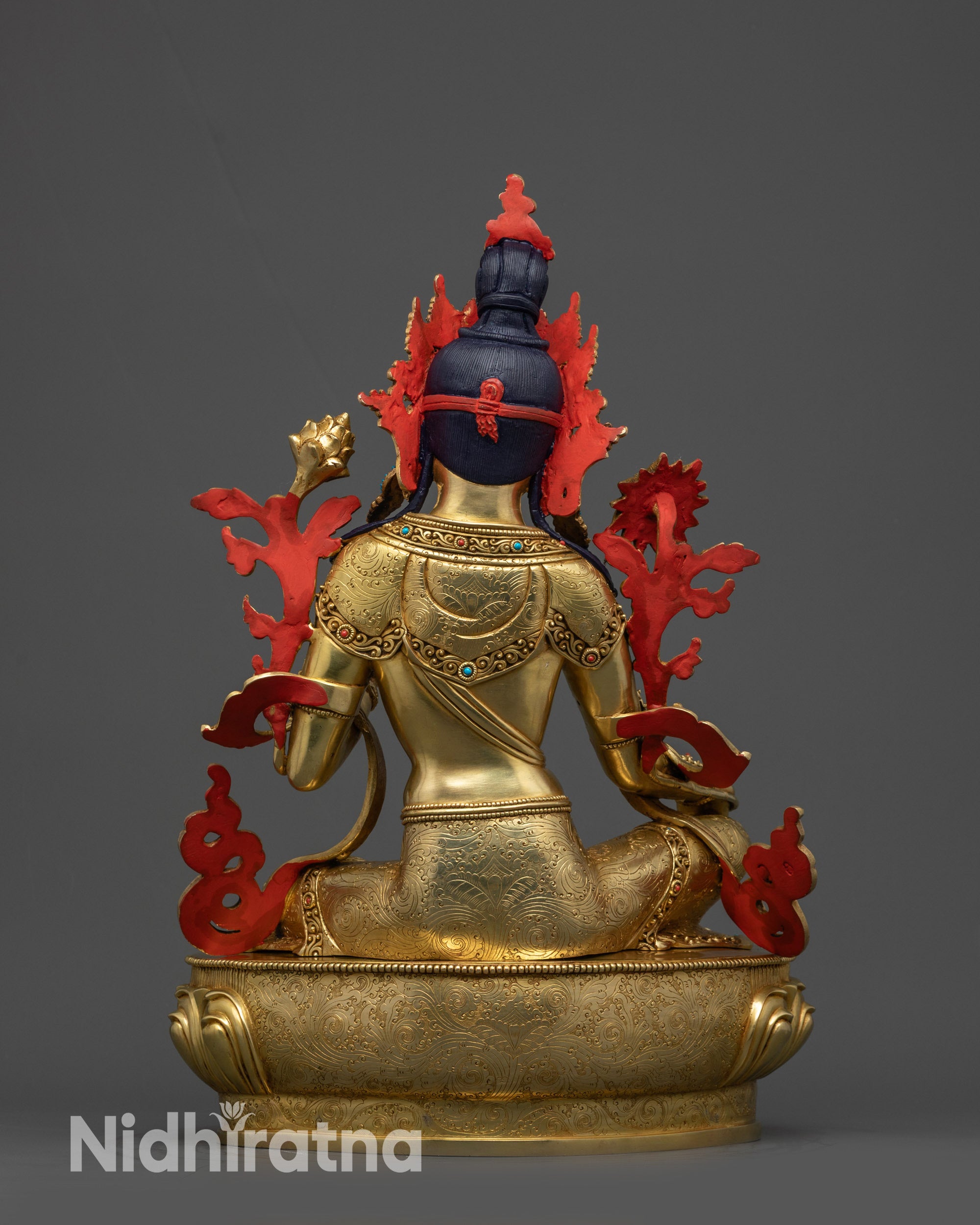 Back view of Green Tara Statue displaying carved flowing robes