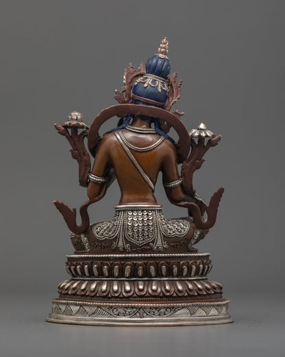 Back view of Green Tara Statue highlighting oxidized copper body and intricate carvings.
