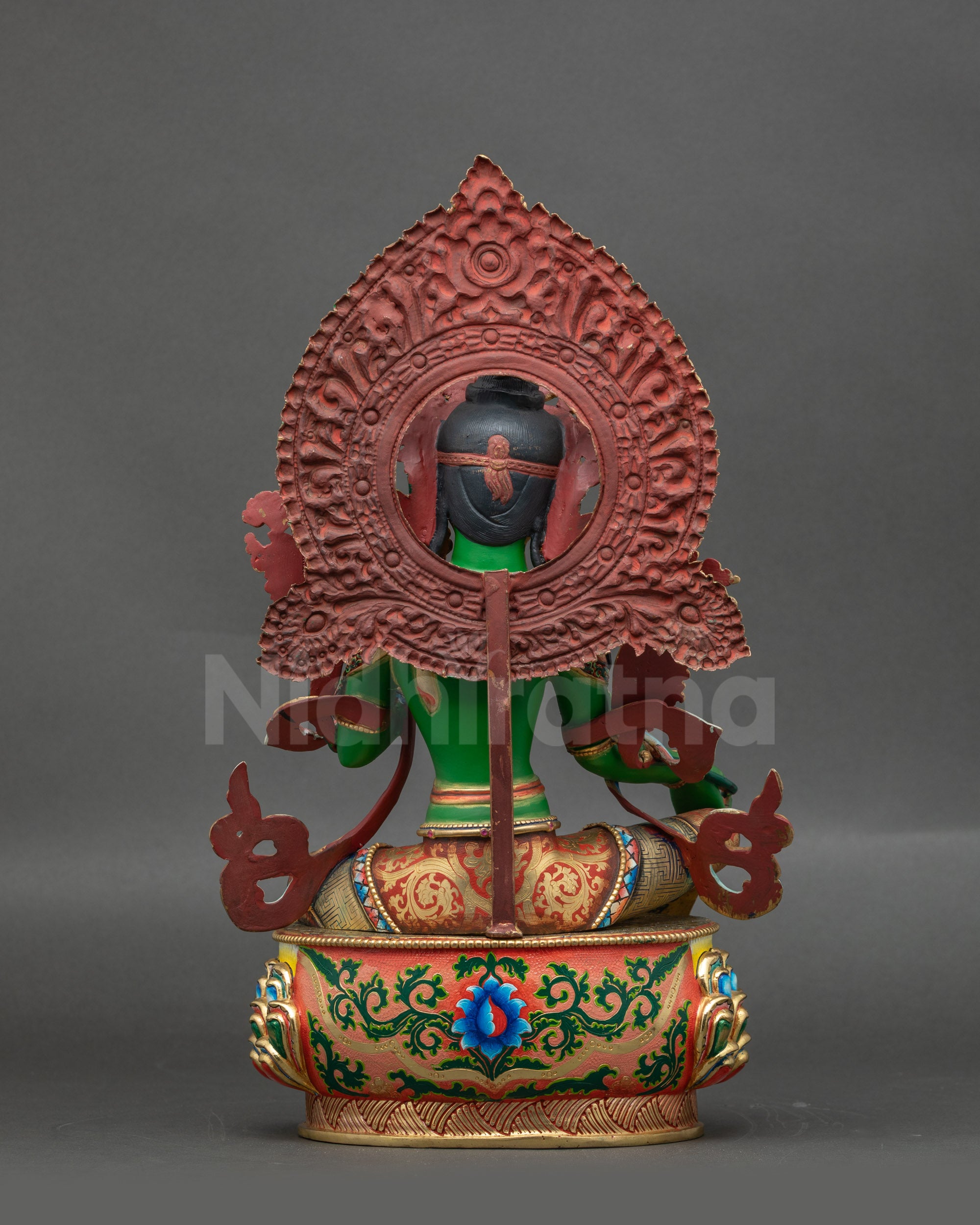 Back view of Green Tara Statue showing carved copper base and detailed lotus seat patterns