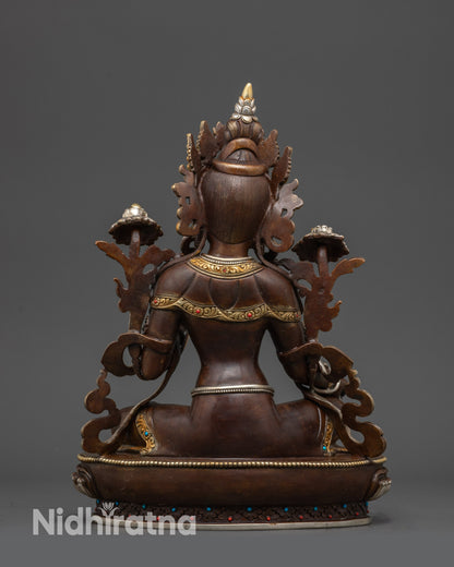 Back view of Green Tara Statue showing detailed robe and carved floral motifs