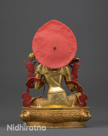 Back view of Green Tara idol highlighting carved patterns and royal ease posture