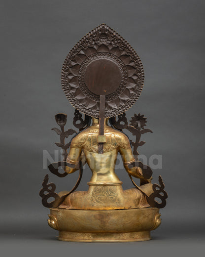 Back view of Green Tara sculpture showing carved jewelry and lotus seat patterns