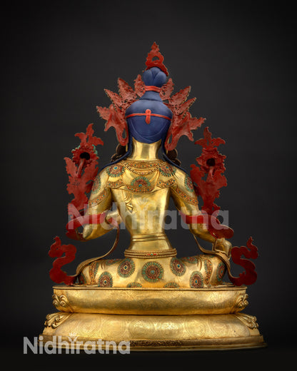 Back view of Green Tara sculpture with Tibetan auspicious symbols and lotus carvings