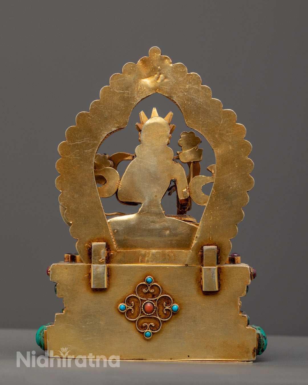 Green Tara statue highlighting the fine stone craftsmanship and traditional hollow consecration chamber for sacred mantras.