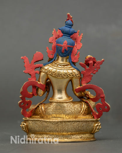 Back view of Green Tara statue showing carved robe and lotus pedestal