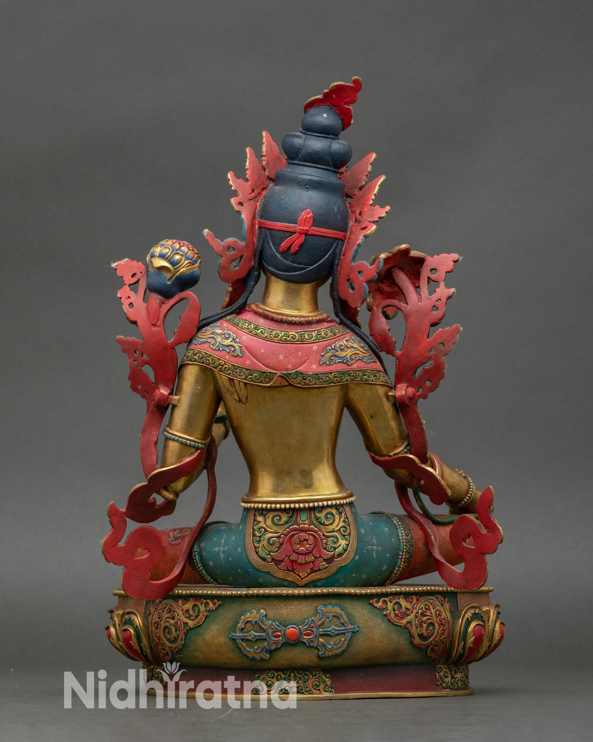 Back view of Green Tara statue showing copper craftsmanship and detailed garments