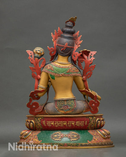 Back view of Green Tara statue showing detailed floral robes and lotus pedestal