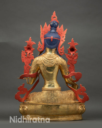 Back view of Green Tara statue with detailed robe carving and lotus seat
