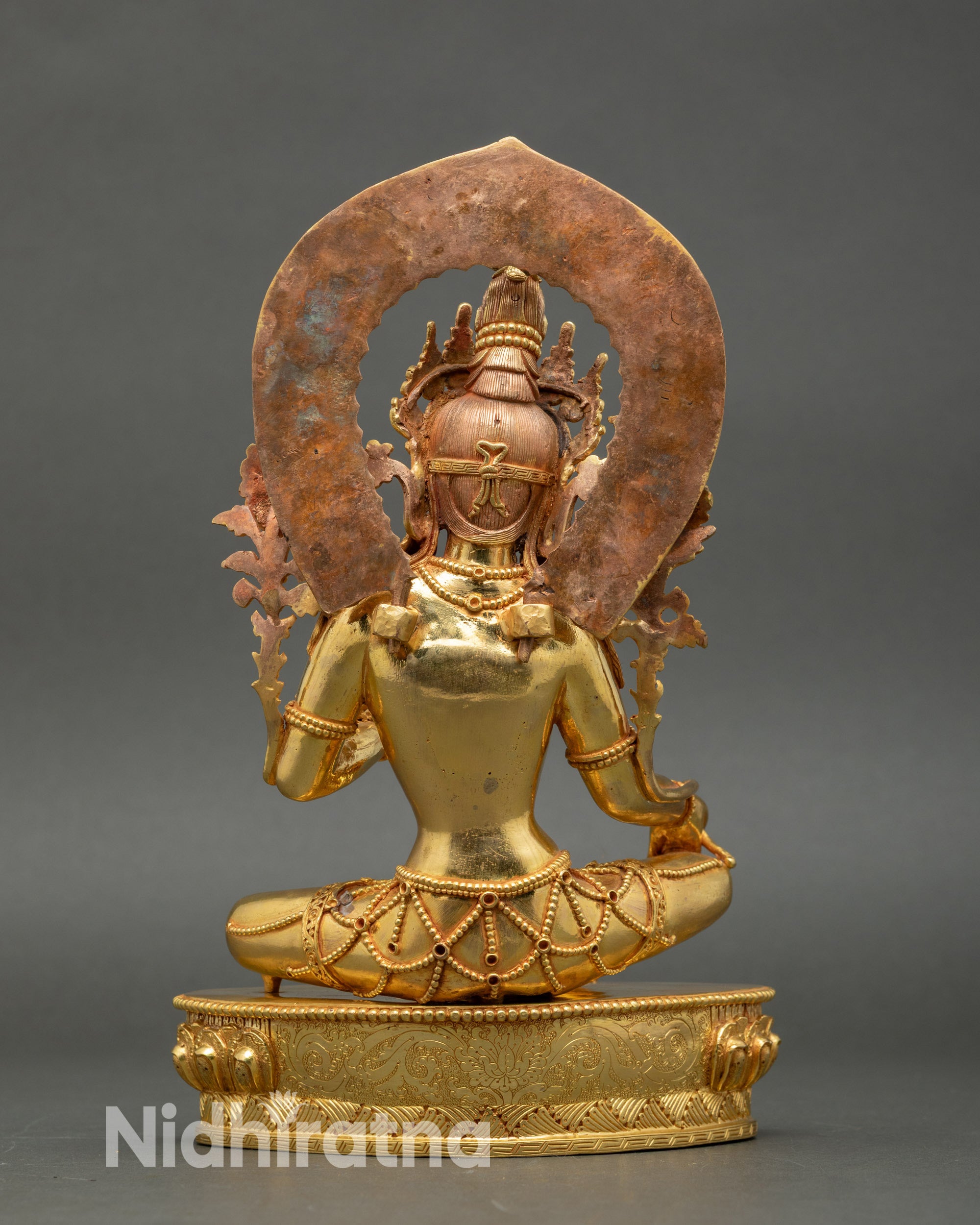 Back view of Green Tara statue with lotus seat and halo, handcrafted Nepalese art