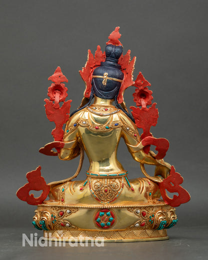 Back view of Green Tara statue with ornate halo and engraved lotus pedestal