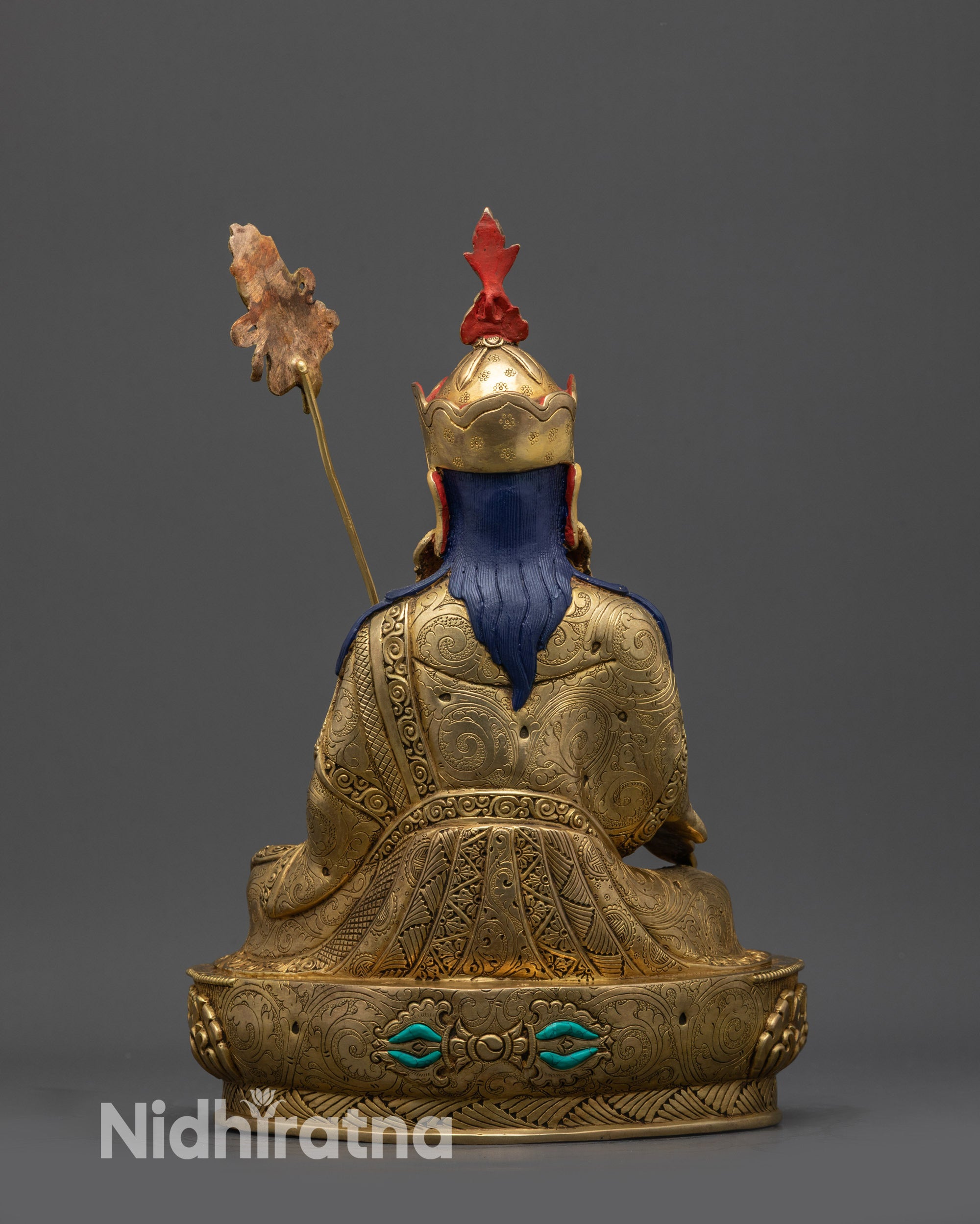 Back view of Guru Norlha statue showing detailed kasaya, lotus pedestal, and Nepalese craftsmanship