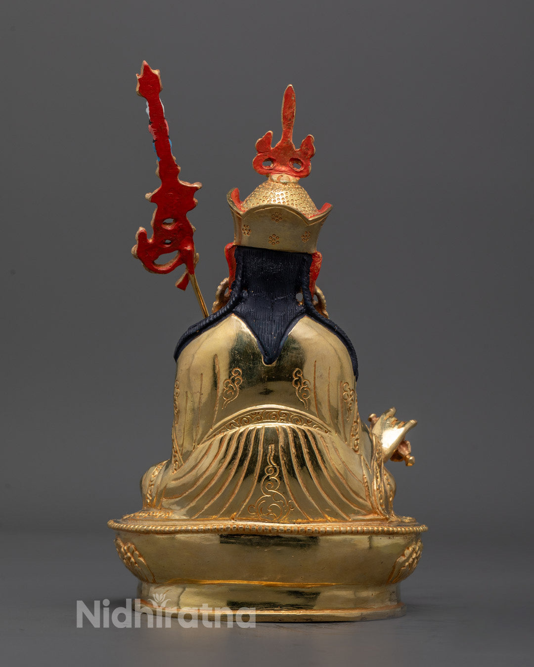 Back view of Guru Padmasambhava Sculpture displaying detailed robe and ornament carvings