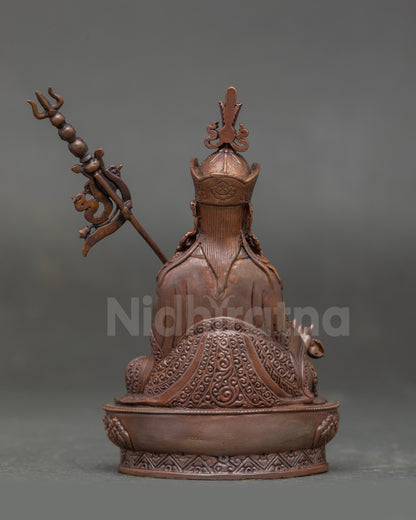 Back view of Guru Rinpoche Statue highlighting monastic garments and lotus pedestal craftsmanship