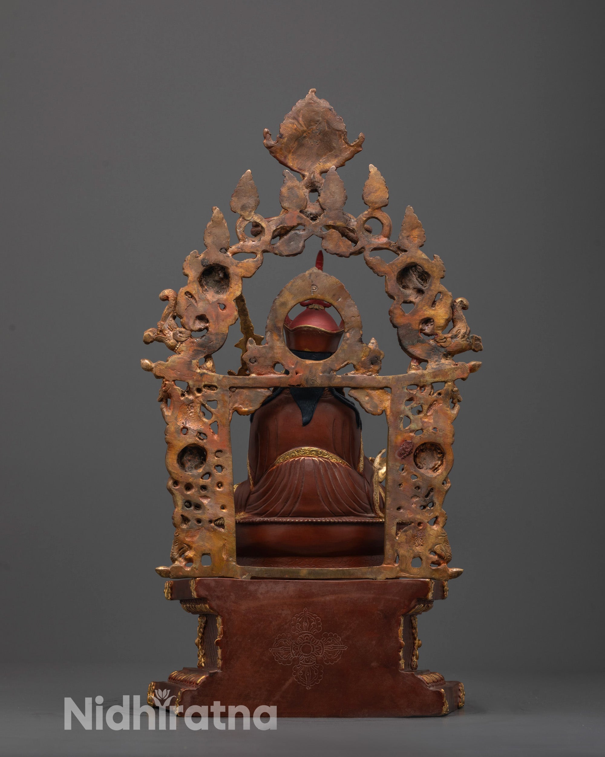 Back view of Guru Rinpoche Statue with detailed throne and partially gold-plated halo design