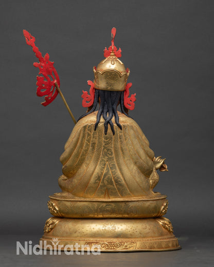 Back view of Guru Rinpoche statue – Nepalese copper and gold Buddhist sculpture showing artisan-crafted robe and pedestal