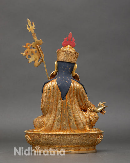 Back view of Guru Rinpoche statue highlighting detailed lotus throne and copper craftsmanship
