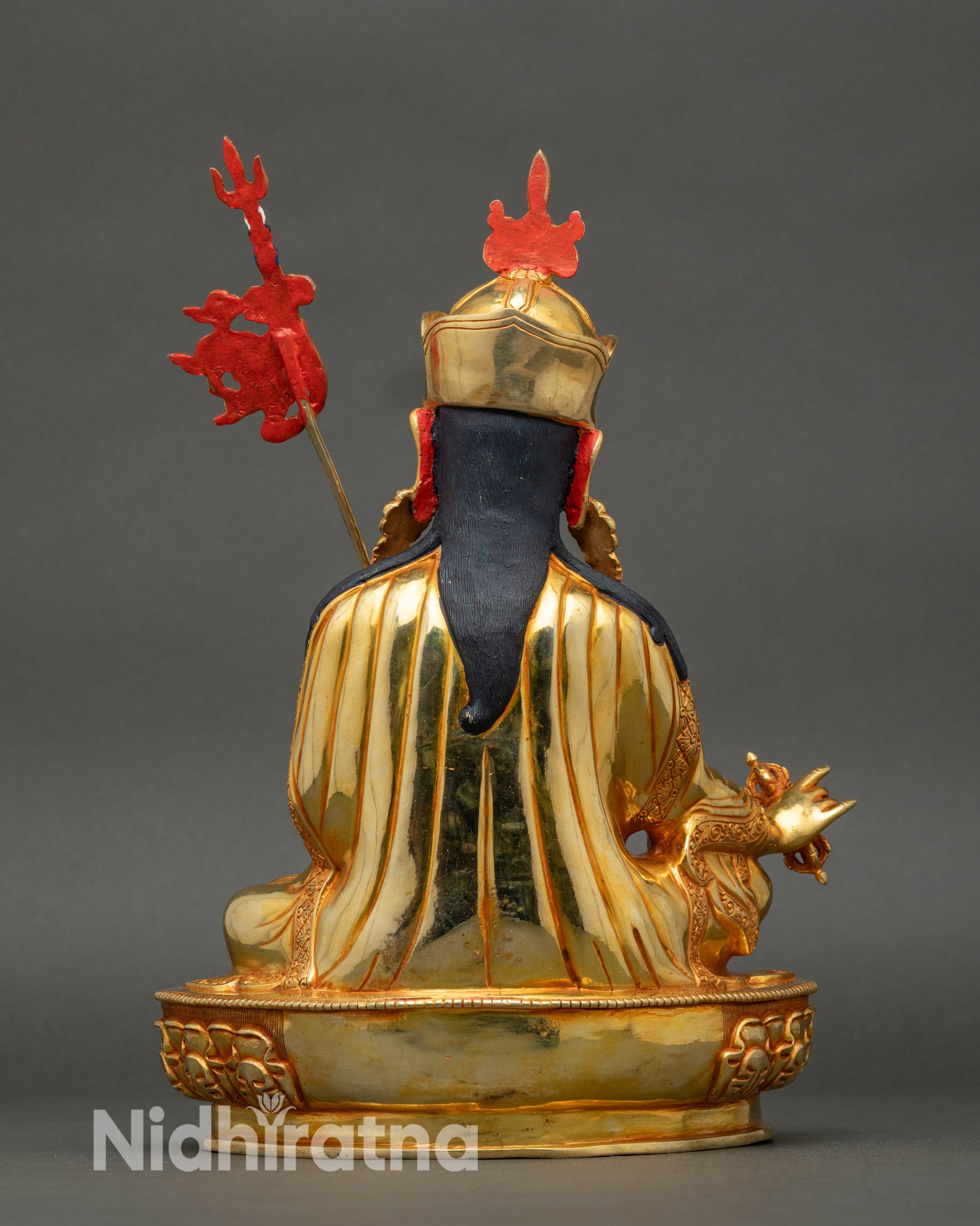 Back view of Guru Rinpoche statue revealing detailed carvings and lotus throne craftsmanship