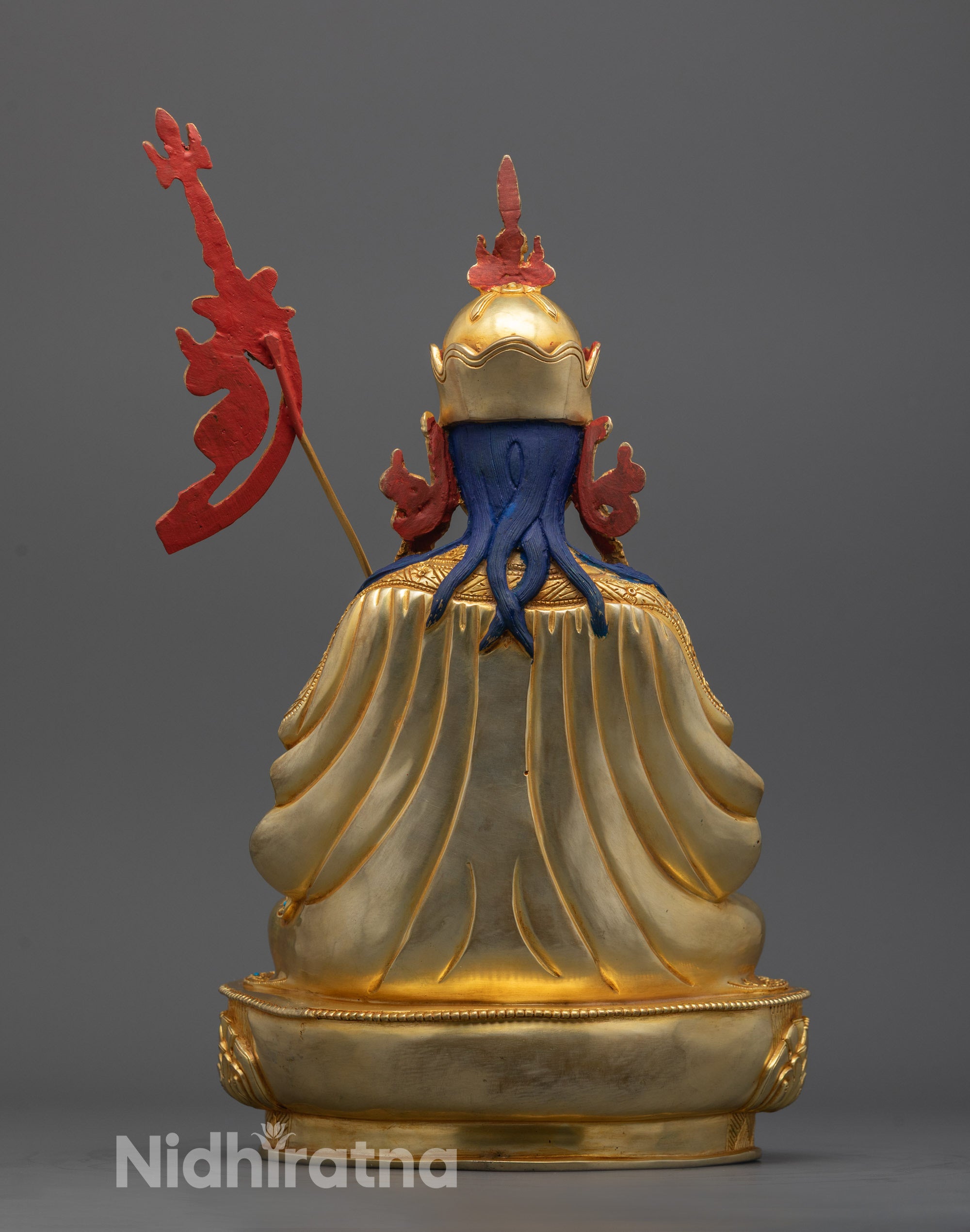 Back view of Guru Rinpoche statue showcasing intricate robe patterns