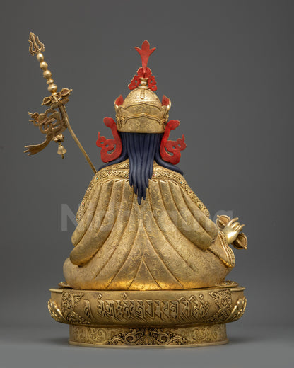 Back view of Guru Rinpoche statue showing intricate carvings on robes and base