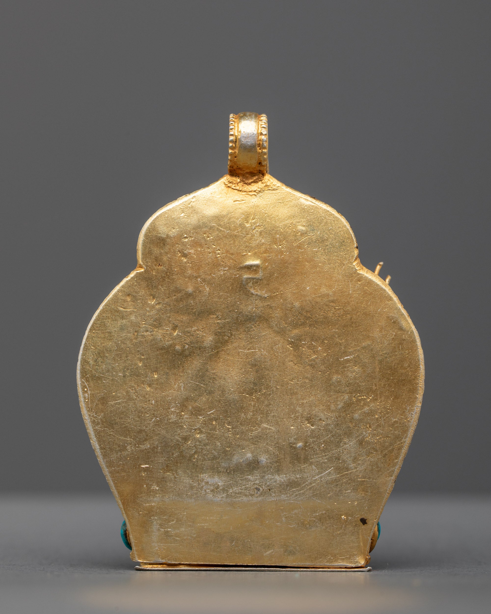 Back view of Handmade Manjushri Locket showcasing fine craftsmanship and traditional Himalayan gold-gilded metalwork.