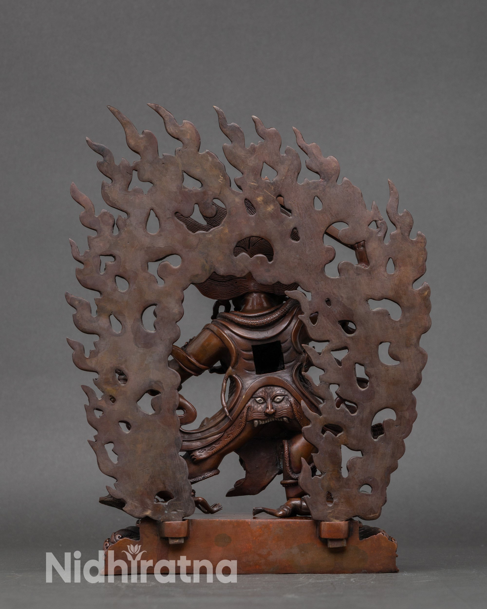 Back view of Hayagriva statue with lotus seat and intricate oxidized copper details