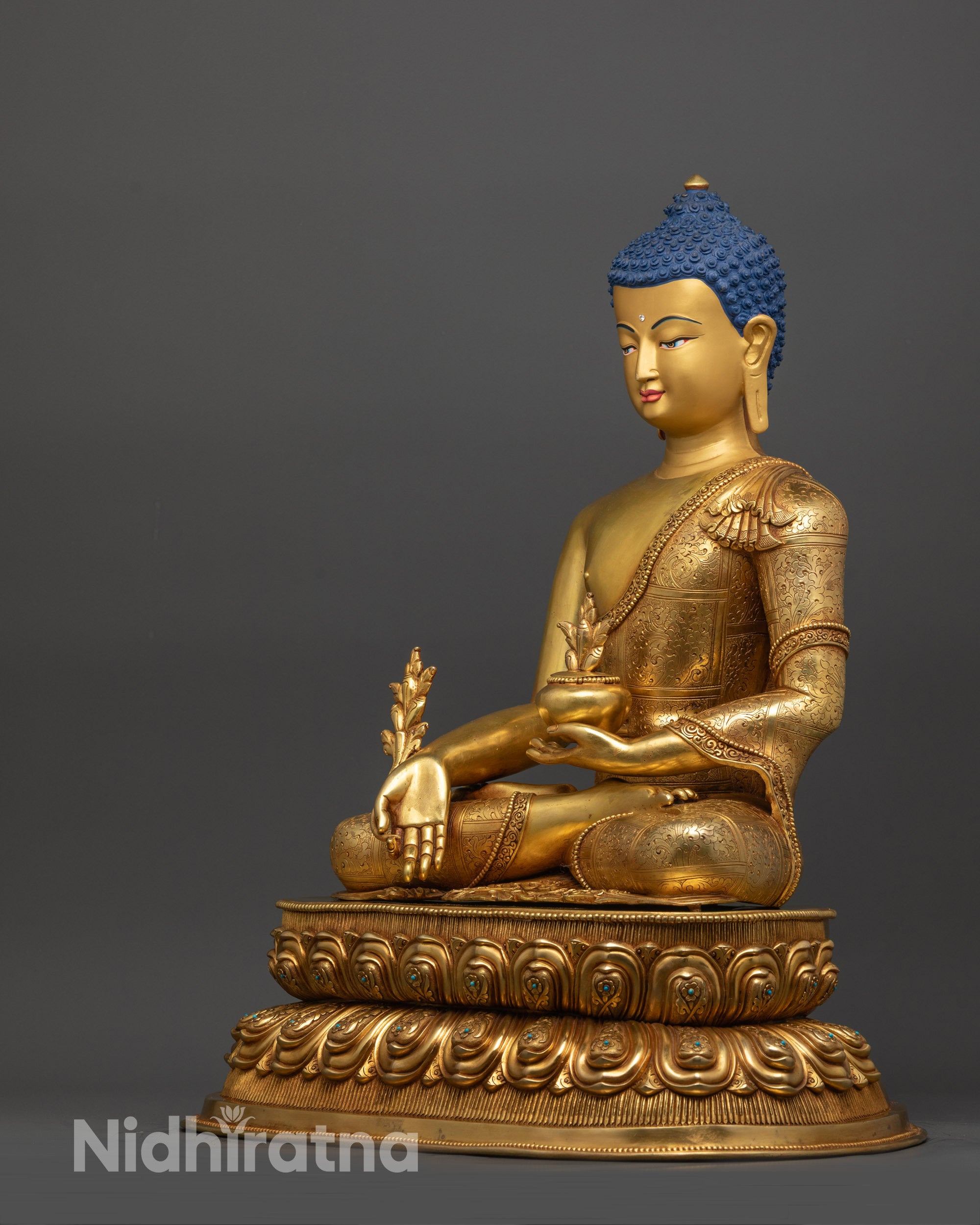 Back view of Healing Buddha statue with detailed gold fire-gilded robe craftsmanship