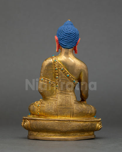 Back view of Himalayan artisan-made Shakyamuni Buddha copper statue with detailed patterns