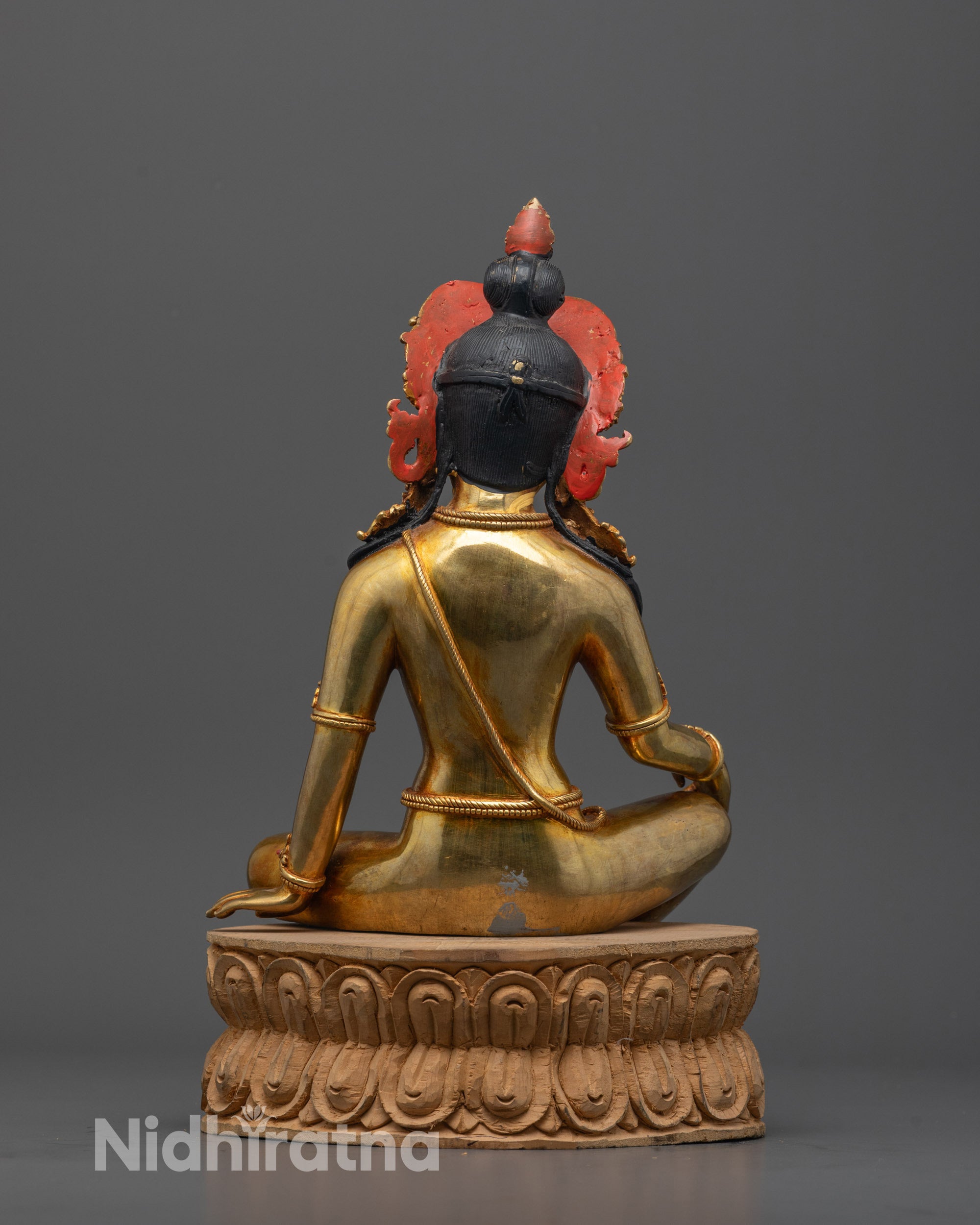 Back view of Indra Statue seated on wooden base highlighting craftsmanship and sacred aura