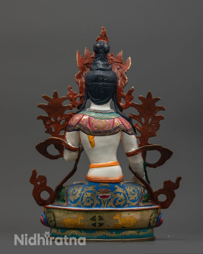 Back view of Jetsun Drolma showing carved lotus pedestal and intricate robe patterns