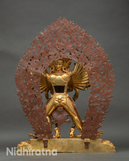 Back view of Kalachakra statue, intricate halo and craftsmanship, Tibetan Buddhist art