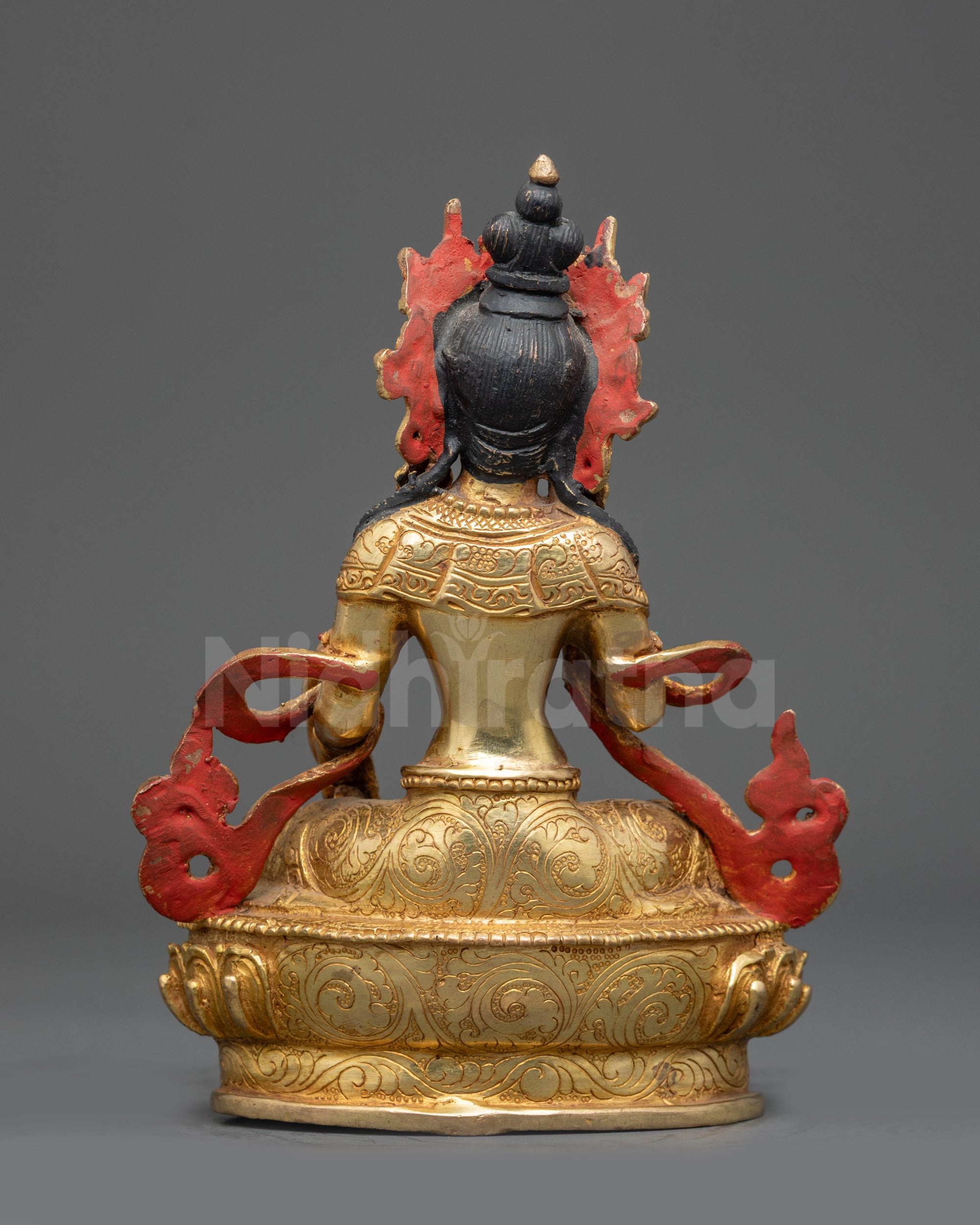 Back view of Kshitigarbha Bodhisattva statue showing halo and detailed robe patterns