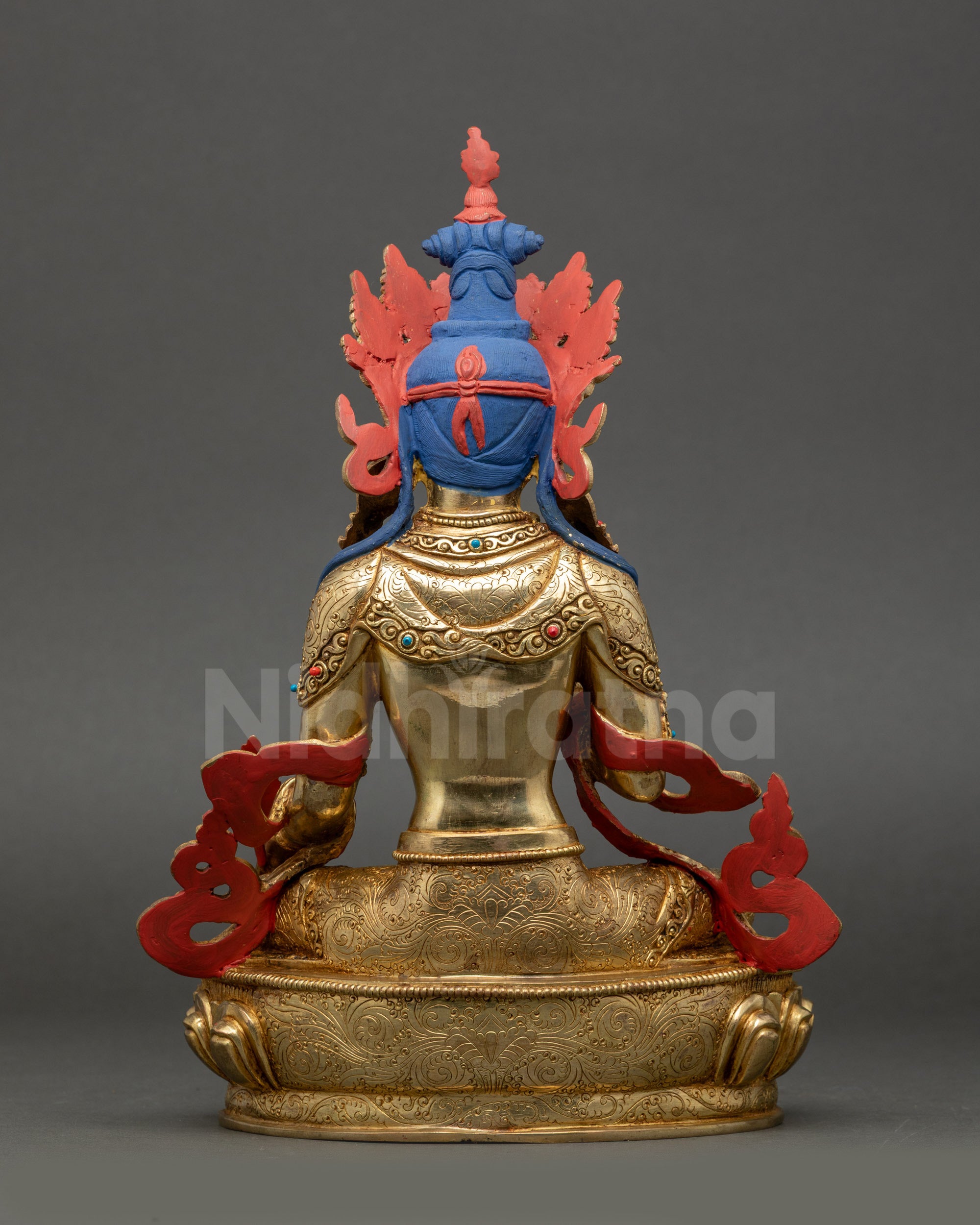 Back view of Ksitigarbha statue showing intricate carved robe and lotus pedestal