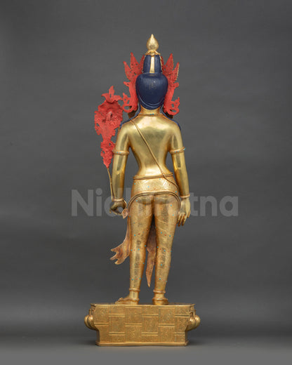 Back view of Lokeshvara statue showing gold fire-gilded base and copper alloy details