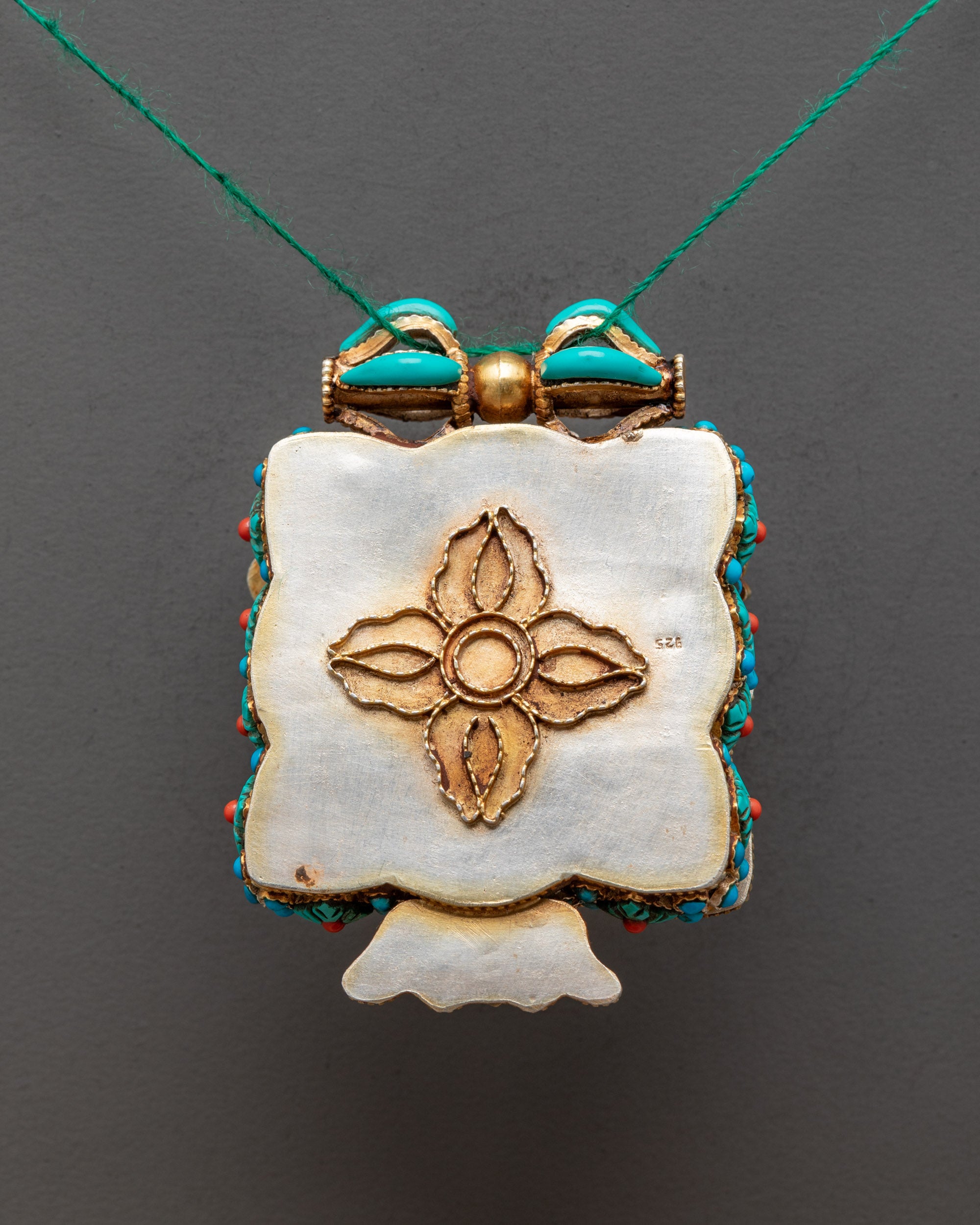 Back view of Mahakala Praying Box Locket displaying detailed carving and craftsmanship