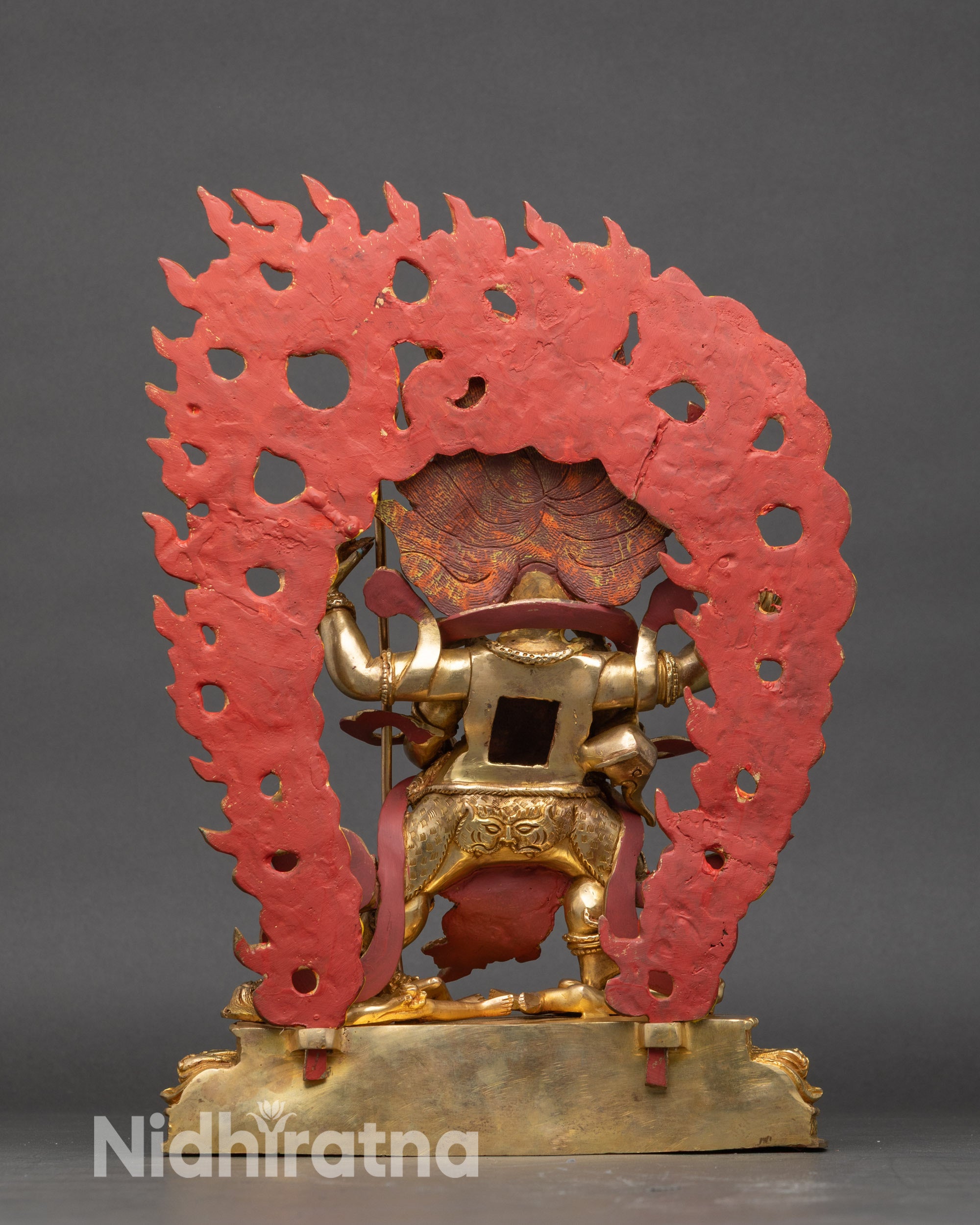 Back view of Mahakala statue with hand-painted wisdom flame halo and detailed sculpted robe