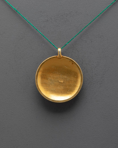 Back view of Mandala Locket showing gold-plated copper and fine filigree craftsmanship