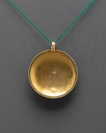 Back view of Mandala Pendant highlighting traditional craftsmanship and delicate carving