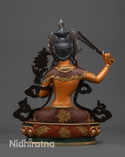 Back view of Manjushri Bodhisattva statue showing gold-plated garment designs