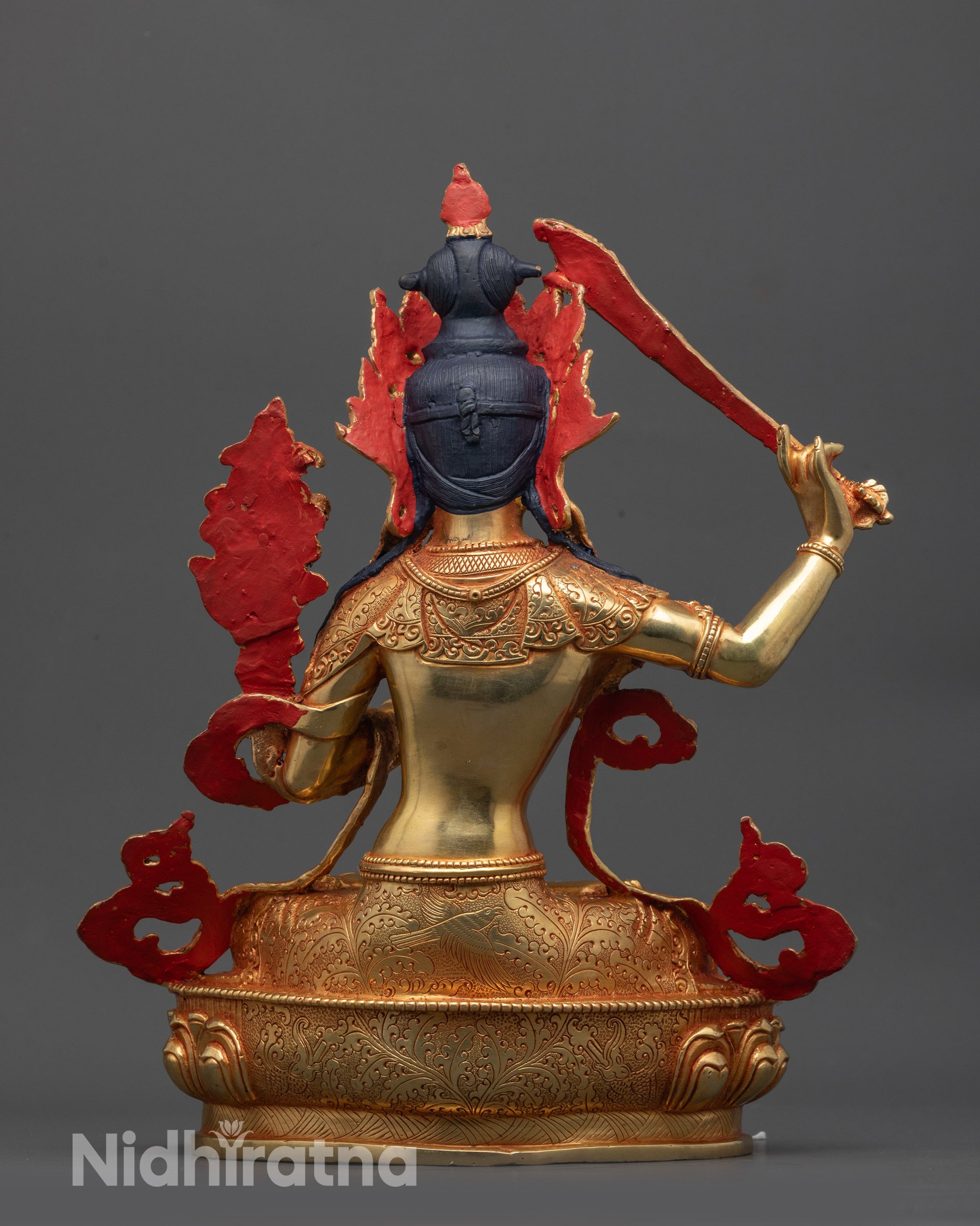 Back view of Manjushri Statue revealing solid copper base and detailed artisan work