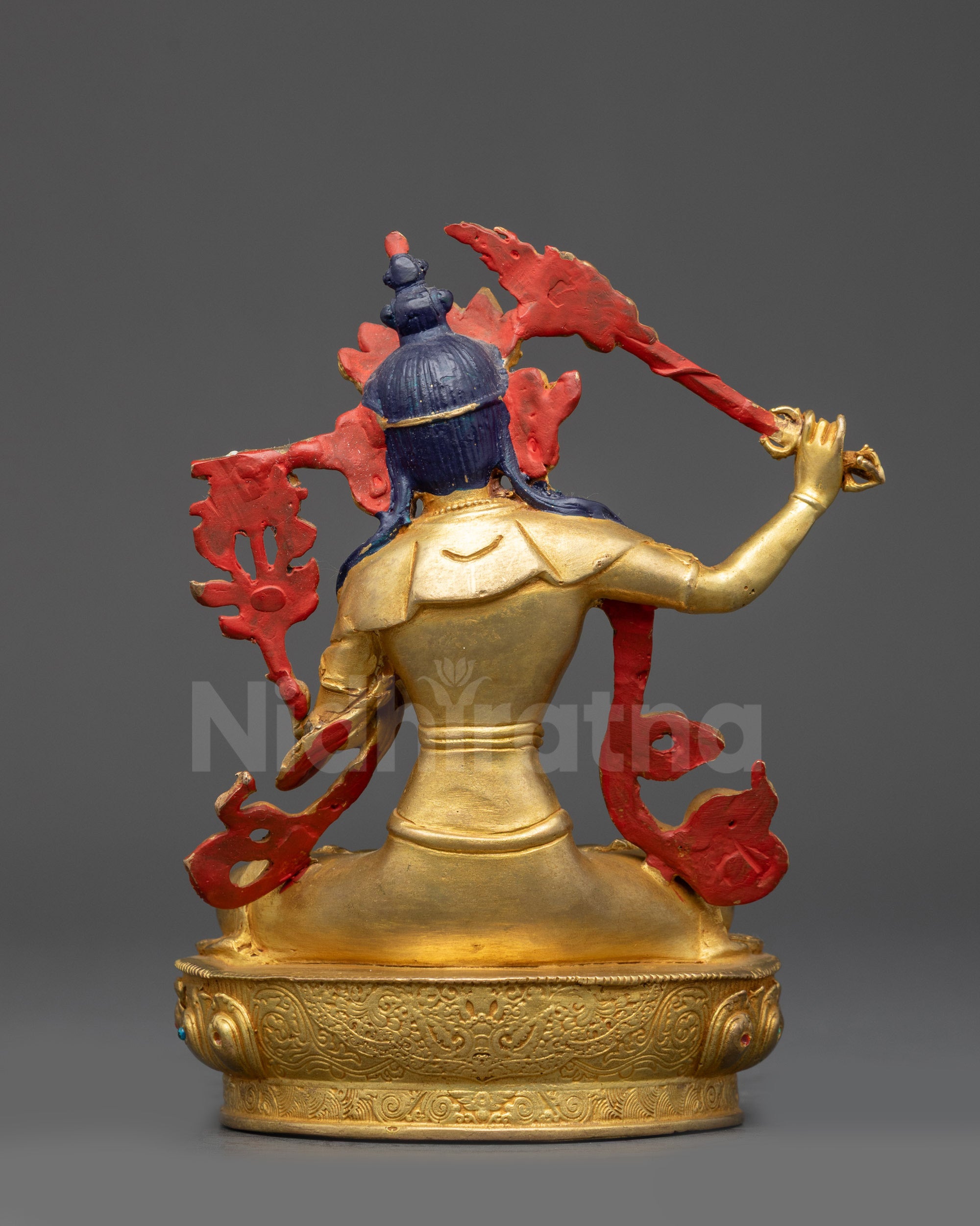 Back view of Manjushri Statue showing detailed garment patterns and artisan craftsmanship