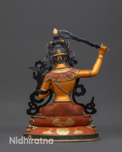Back view of Manjushri Statue showing double-layered lotus base with dharma wheel and deer