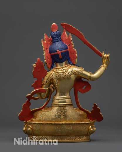 Back view of Manjushri Statue showing swirling robes and Himalayan craftsmanship