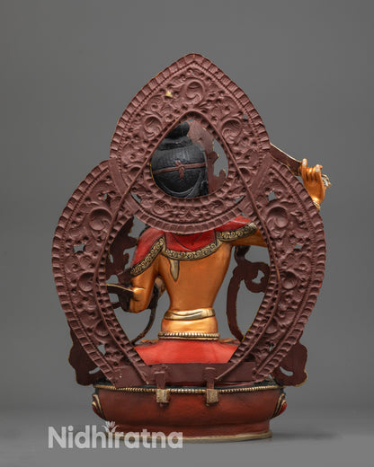 Back view of Manjushri statue showing gold-plated robes and copper alloy base